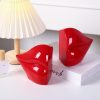supplier direct red lips decorated bookends，set of 2 heavy decorative book stoppers，unique resin decoration，creative desktop red decor for study room hotel office shelves wholesale prices