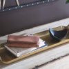 wholesale direct signature design by ashley posy decorative metal serving tray, gold finish bulk purchase at factory prices