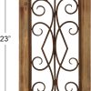 bulk purchase deco 79 wood scroll home wall decor window inspired wall sculpture with metal scrollwork relief, wall art 11" x 2" x 23", brown trade price